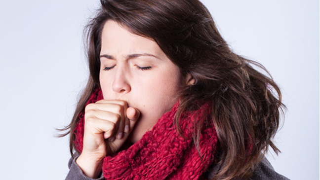 Coughing girl in scarf